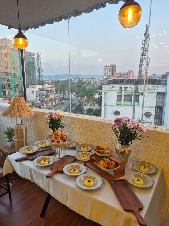 The terrace of Sky Mews at sunset, over the city